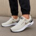 Nike Air Zoom running shoes in a light beige/tan colorway wi